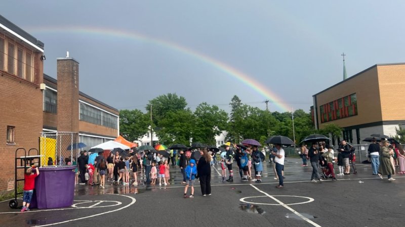 Grand Finale: rainbow and people in the school yard